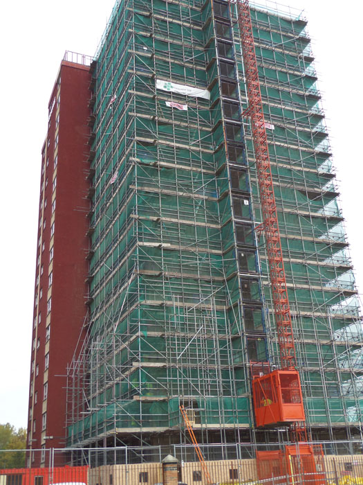 Fully scaffolded tower block concrete repairs by Frescrete