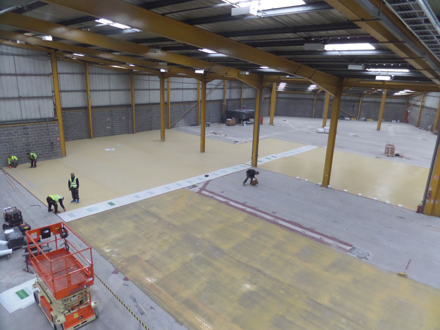 Polyurethane resin screed being applied to a food storage warehouse